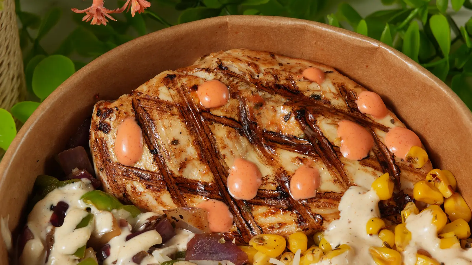 Grilled chicken over rice with corn and peppers